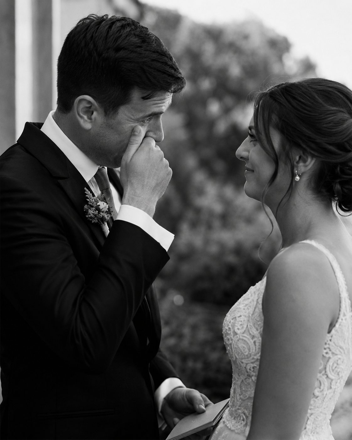 An emotional black and white first look moment