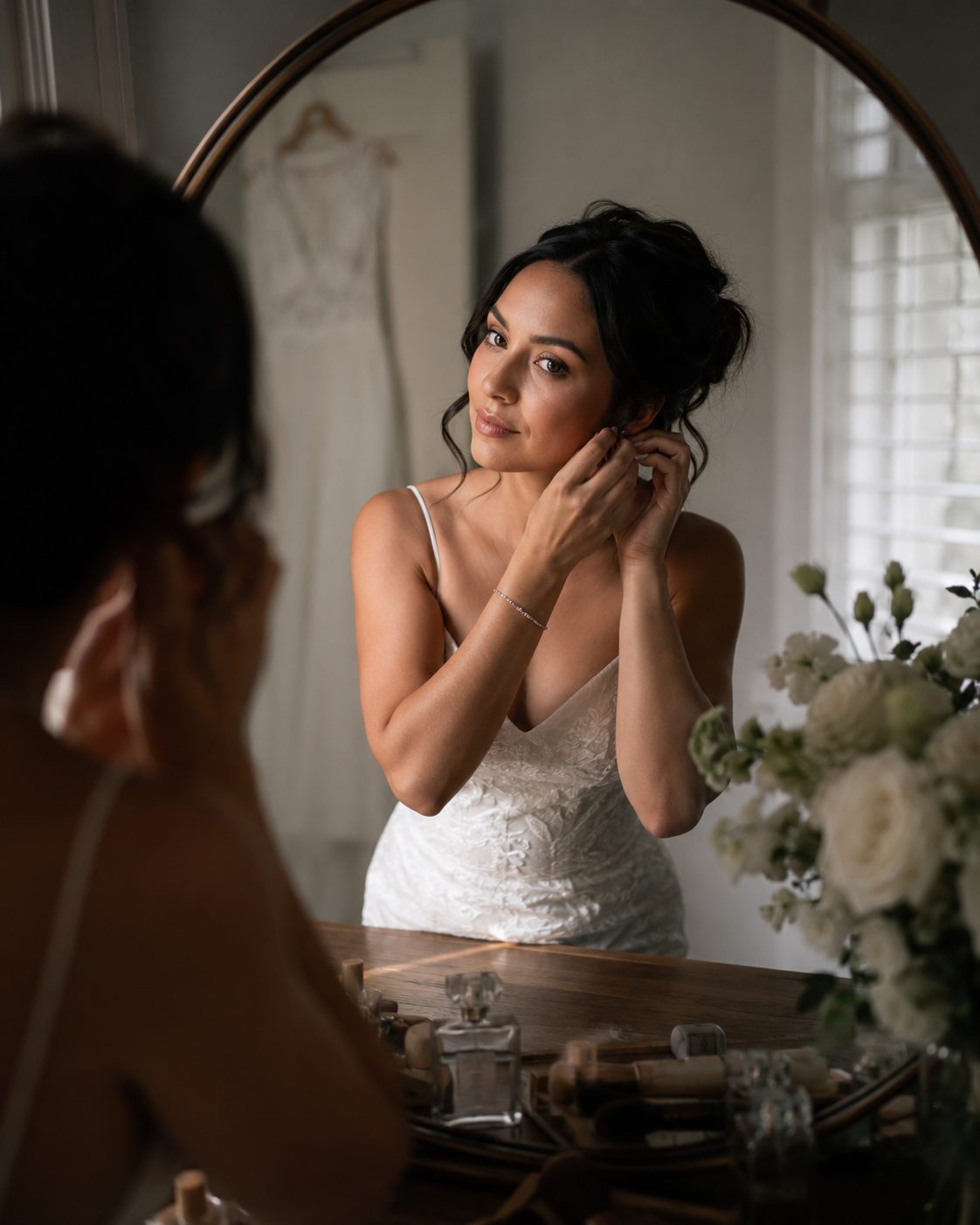 A bride getting ready in a mirror